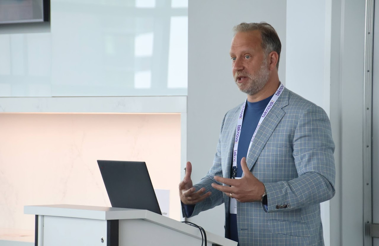 Group of colleagues greeting each other in a stylized blue duotone treatment