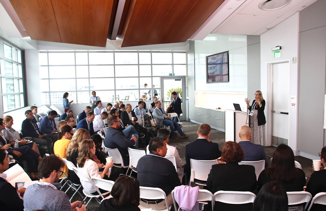 Group of colleagues greeting each other in a stylized blue duotone treatment
